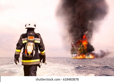 Firefighter in oil and gas industry with mission successful for protect with emergency case or worst case, Personal protective equipment of firefighter team and teamwork for danger mission.