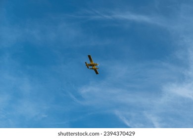Firefighter plane flying in the blue sky fighting fires
