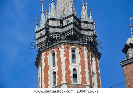 A firefighter playing the bugle call on the tower of St. Mary's Church in Krakow