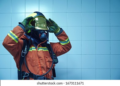 Firefighter With Respiratory Assistance And Protection Prepares To Enter A Hospital Fire