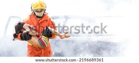 Firefighter to save girl in fire and smoke. Rescue Team or Firefighters save lives people from fire. Firefighter or Emergency team rescue saving life people from fire