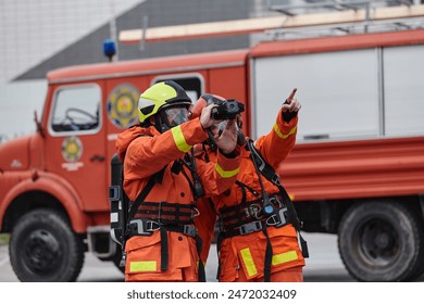 Firefighter Team Learning Thermal Camera Usage During Training Session