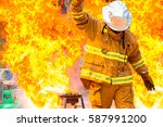 Firefighter training., fireman using water and extinguisher to fighting with fire flame in an emergency situation., under danger situation firemen wearing fire fighter suit for safety