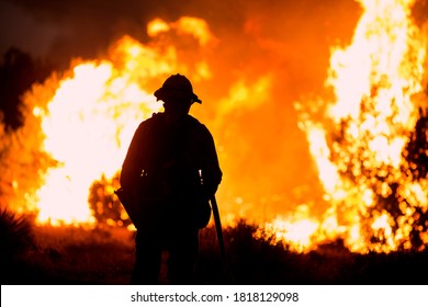 A Firefighter Watches As The Bobcat Fire Burns In Juniper Hills, California, Saturday, Sept. 19, 2020. 