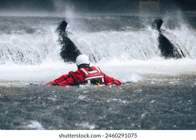 Firefighter in water under dangerous wier during drowning rescue training.
 - Powered by Shutterstock