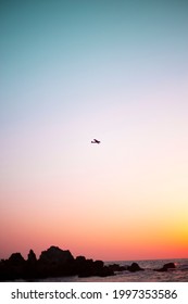 Firefighters Cessna Flying Over The Sea At Sunset