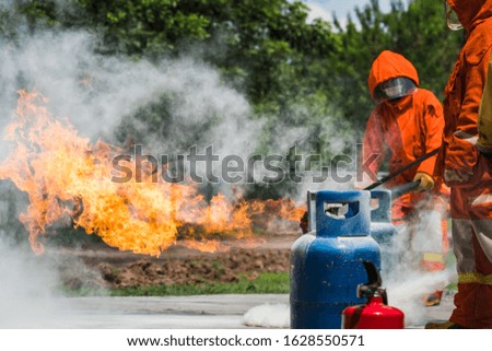 Firefighters are demonstrating fire fighting