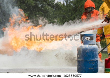 Firefighters are demonstrating fire fighting