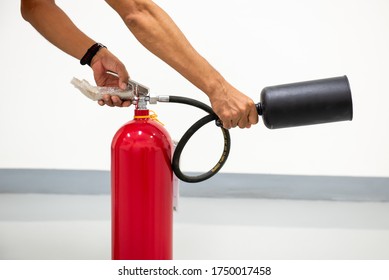 Firefighters are demonstrating the use of fire extinguishers. - Shutterstock ID 1750017458