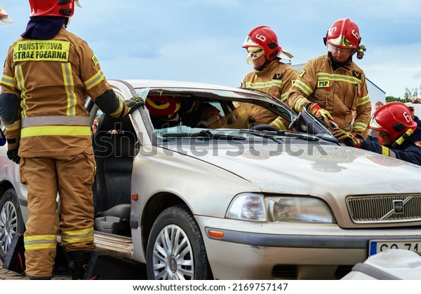 Firefighters during a rescue operation training.\
Rescuers unlock the passenger in car after accident. Katy\
Wroclawskie, Poland - May 28,\
2022