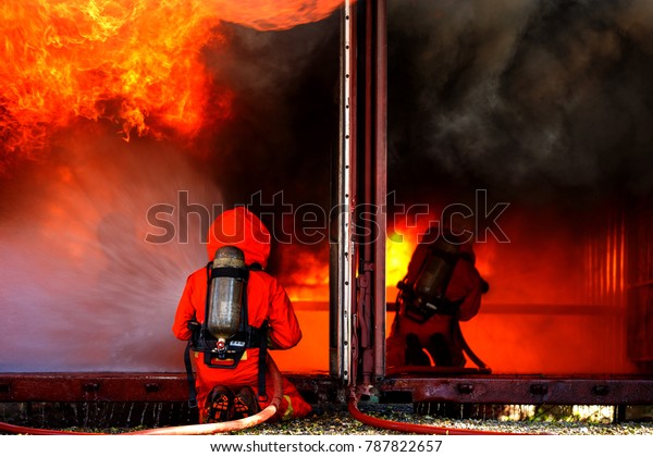 Firefighters are\
fighting fire with a  fire\
brigade