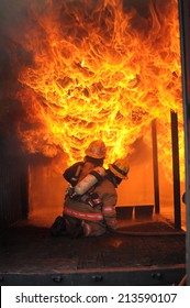 Firefighters Fighting Fire During Training