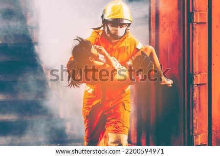 Firefighters, Firemen spraying high pressure water or suitable extinguishing agents to fire.fire fighter Using Twirl water mist fire extinguishers to fight oil flames to control fires from spreading.