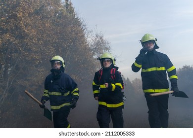 Firefighters Men And Woman At Action, Running Through Smoke To Stop Fire In Forest.