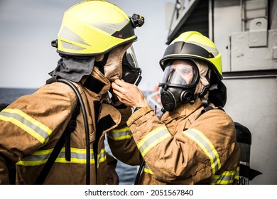 Firefighters prepare to fight a fire