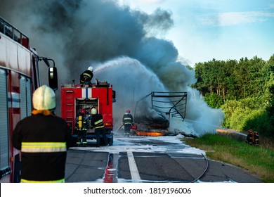 Firefighters put out the fire with foam in the car, fire engine extinguishes a fire on the road