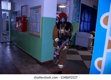 Firefighters Rescue Children From School. Belarus/Oshmyany/25 November 2018. Practicing The Actions Of Rescuers During A Fire. Evacuation Of Children