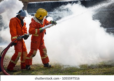 Firefighters Training, Team Practice To Fighting With Fire In Emergency Situation.
Spray Foam Water To The Flame