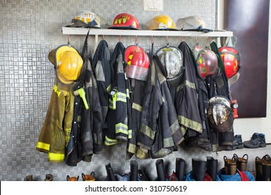 Firefighter's Uniforms And Gear Arranged At Fire Station