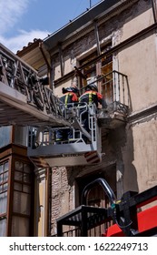 Firefighters uploaded on an elevating platform, attending an emergency
