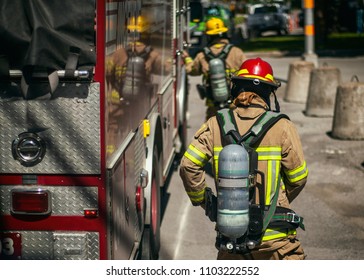 Firefighters walking to the fire truck after responding an emergency call
