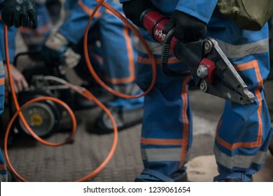 Firefighters Work On An Extrication Using A Hydraulic Rescue Tool