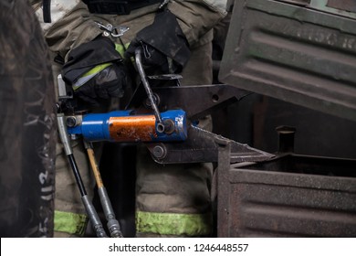 Firefighters Work On An Extrication Using A Hydraulic Rescue Tool