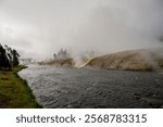 The Firehole River Steams With Hot Water From The Thermal Geysers Above in Yellowstone National Park