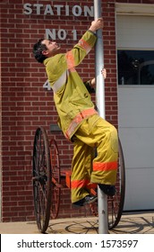 Fireman Climbing A Pole