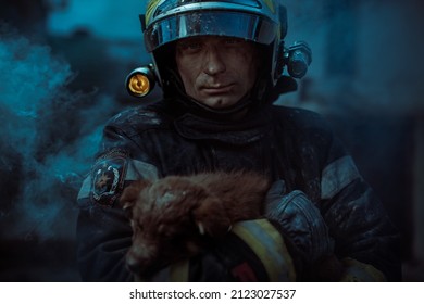 Fireman In Equipment Holding A Dog