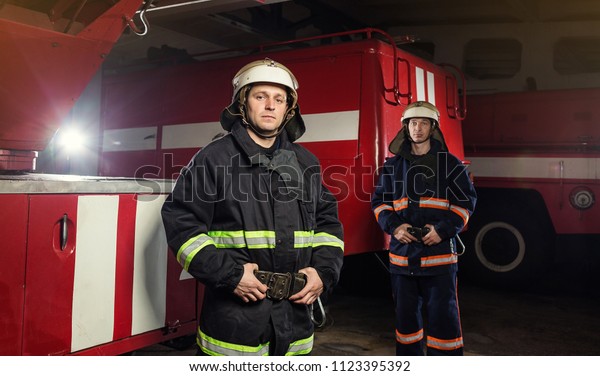 Fireman Firefighter Action Standing Near Firetruck Stock Photo Edit Now 1123395392