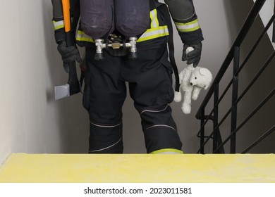 Fireman Holding Plush Toy, Back View