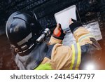 Fireman inspector officer inspects burnt house, take photo on tablet for report of investigating incident fire. Control safety after burning apartment.