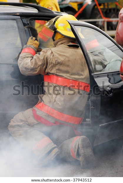 Fireman at the scene of a\
car accident.