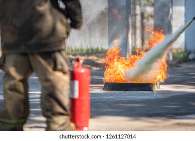 Fireman Showing Use Fire Extinguisher On Stock Photo (Edit Now) 1261127014