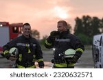 fireman using walkie talkie at rescue action fire truck and fireman