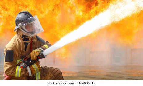 Fireman,Firefighter training Firefighters using water and fire extinguishers to fight the flames in emergency situations. in a dangerous situation All firefighters wear firefighter uniforms for safety - Shutterstock ID 2186906515