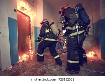 Firemans team during firefighting