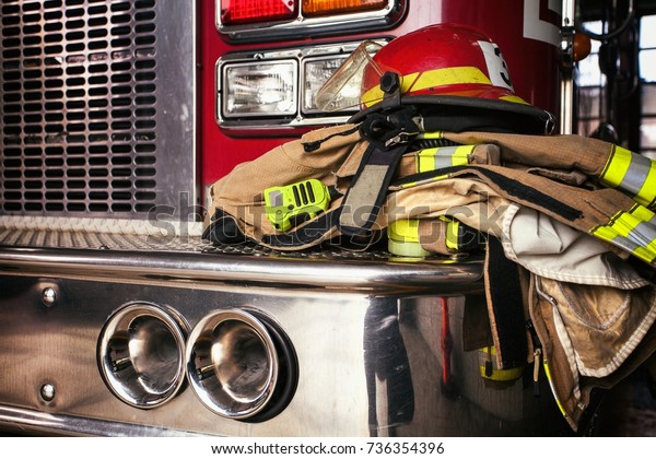 Firemen gear on\
firetruck