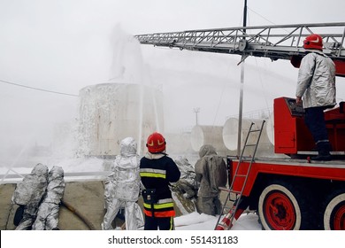 Firemen Pouring Flame With Firefighting Foam