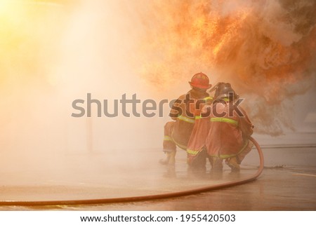 
Firemen practice fighting the fire.Fireman team fire drills.