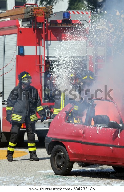firemen put out the fire with\
foam