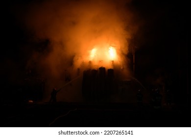 Firemen put out a fire on a transformer after the missile attack in Ukraine - Shutterstock ID 2207265141