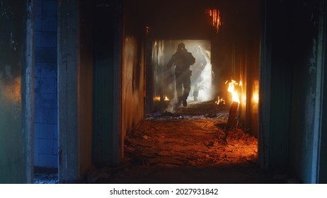 Firemen Running Through Fire And Looking For Survivors