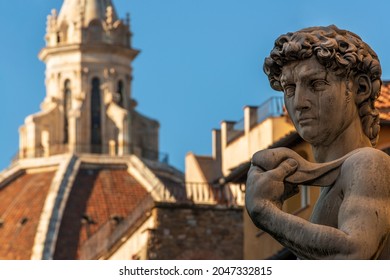 Firenze, FirenzeItaly - September 2019: The Statue Of Michelangelo’s David With The Cathedral Dome Of Florence In The Background, Shot From Piazza Della Signoria - Florence (Italy)