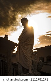 Firenze,FirenzeItaly - September 2021: The Statue Of Dante Alighieri Backlight In Piazza Santa Croce In Florence, Italy