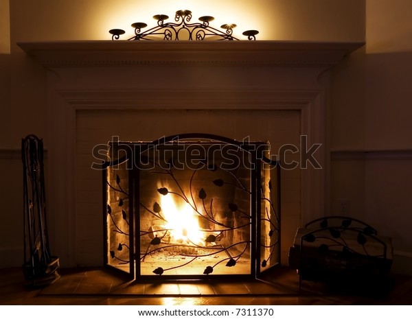 Fireplace Burning Logs Candles On Mantle Stock Photo Edit Now