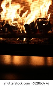 Fireplace burning with screen reflection
