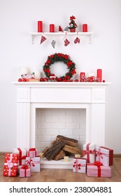 Fireplace With Christmas Decoration On Wooden Floor And White Wall Background