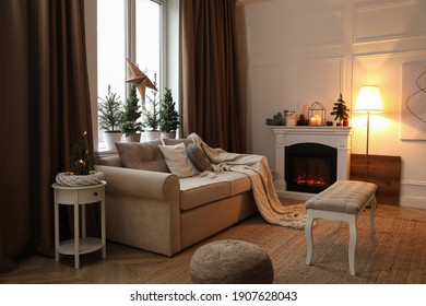 Fireplace In Room With Christmas Decorations. Interior Design